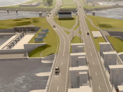 We zien een animatie van de gemalen. Dit is hoe de nieuwe gemalen eruit moeten komen te zien. We zien twee wegen met een calimiteitenkruis in het midden. Aan de zijkant zie je vier witte sluisgebouwen. Je ziet een nieuwe sluis vol met water.